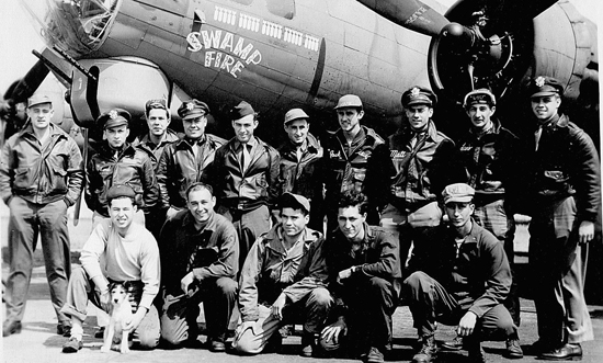 B-17 Serial #42-32024 "Swamp Fire".  This is a picture of the mission crew who flew on her 25th mission on 4 May 1945 (note 24 bombs painted on her side for completed missions). Standing, left to right: TSGT Edward J. Przybyla radio operator, 2LT Harvey "Herk" Harris bombardier, SSGT Roy E. Avery, Jr. waist gunner, 1LT Joseph L. Korstjens pilot, SSGT Andrew Stroman, Jr. ball turret, SSGT Berj G. Bejian engineer, SSGT    John  K. Rose waist gunner, 2LT Matthew J. Scianameo navigator, SSGT Elijah W. Lewis tail gunner, 2LT Byron B. Clark copilot, Lt. Scragg swamp fire's mascot.  Kneeling left to right is the ground crew: Rube Cohn, Seymour Romoff, James Abbott, Henry Gerhart and Dominick DeSalvo