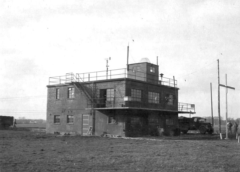 The Control Tower, now demolished, of RAF Glatton, taken on 31 March 1945. In the distance, to the left of the tower, a B-17 is visible on the taxiway. US Air Force Photograph, in the public domain. 